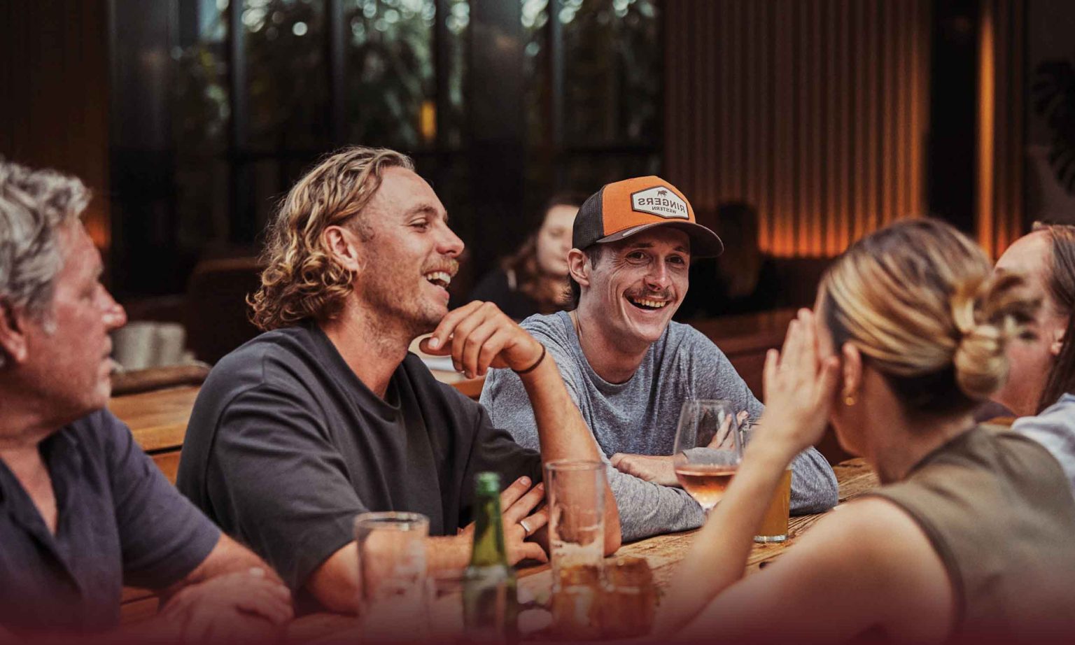 Guys drinking beer at Battery House at DYRSL